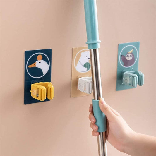 Wall-mounted jhadu and pocha stand firmly holding a wet mop and broom to keep floors clutter-free